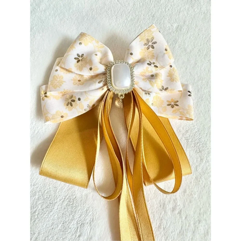 Adorable floral yellow hair bow with floral and pearl accents with hair Barrette